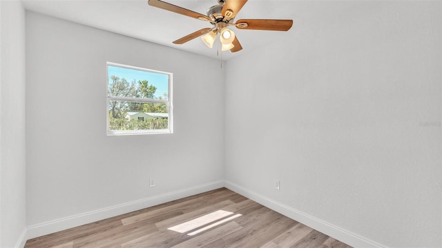 unfurnished room with baseboards, light wood-style floors, and ceiling fan