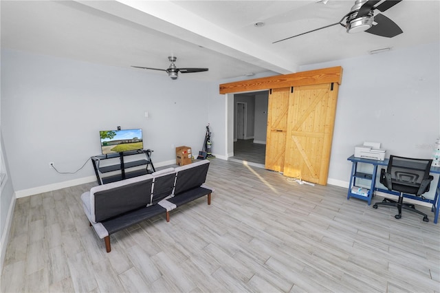 interior space featuring light wood finished floors, beamed ceiling, baseboards, and a ceiling fan