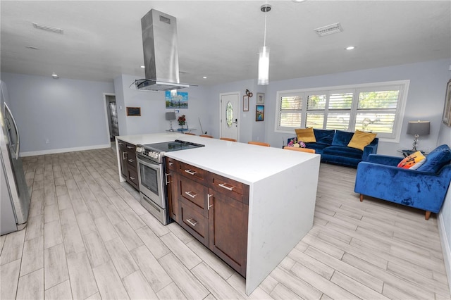 kitchen with ventilation hood, visible vents, wood tiled floor, stainless steel appliances, and open floor plan