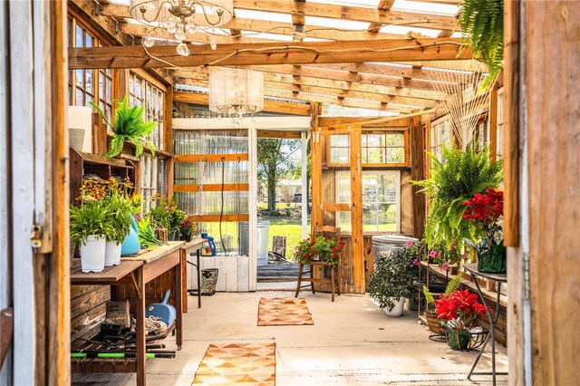 sunroom featuring a notable chandelier