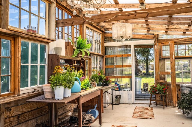 sunroom with an inviting chandelier