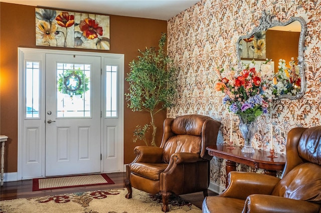 entryway with wallpapered walls, baseboards, and wood finished floors