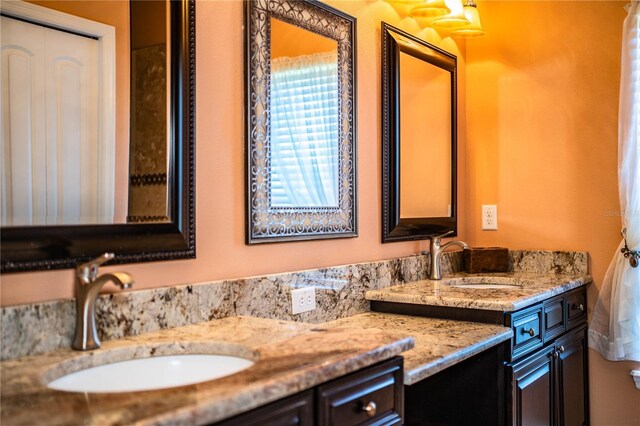 bathroom featuring double vanity and a sink