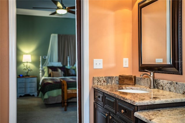 bathroom with vanity, a ceiling fan, and ensuite bathroom