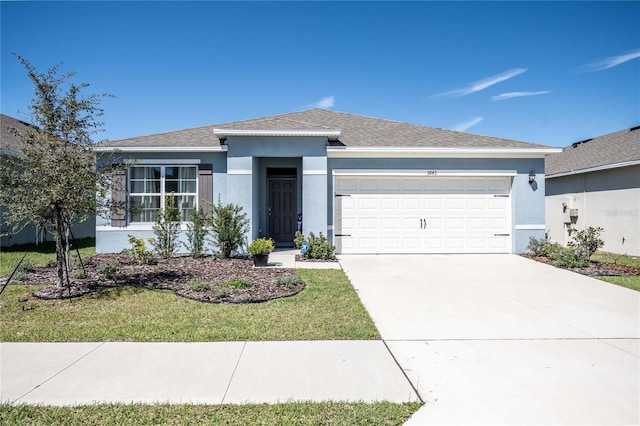 view of front of home with stucco siding, roof with shingles, concrete driveway, and an attached garage