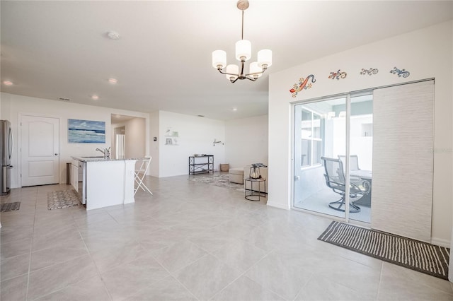 interior space featuring light tile patterned floors, a notable chandelier, and recessed lighting