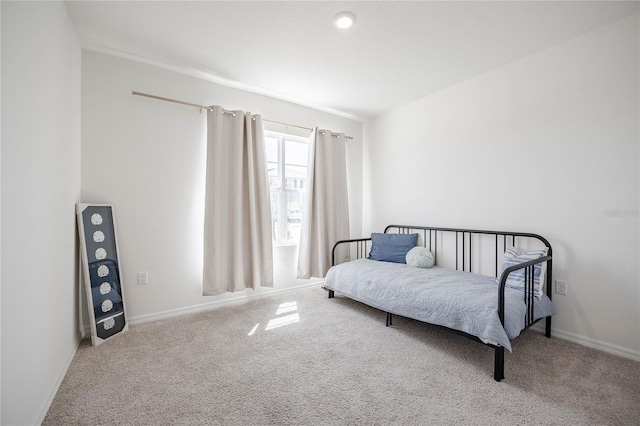 bedroom featuring carpet flooring and baseboards