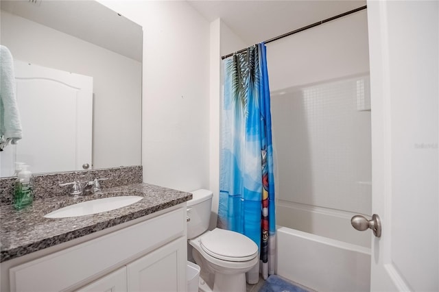 bathroom featuring toilet, vanity, and shower / bath combo