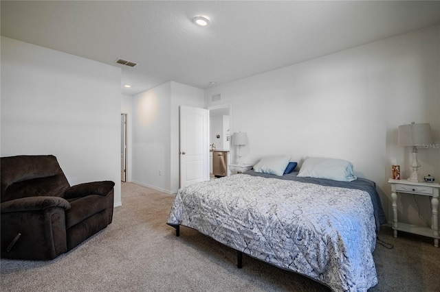 bedroom with carpet flooring, baseboards, and visible vents