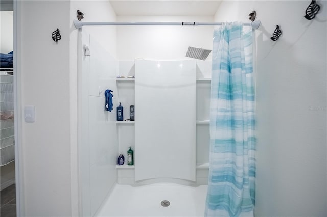 bathroom featuring a shower stall