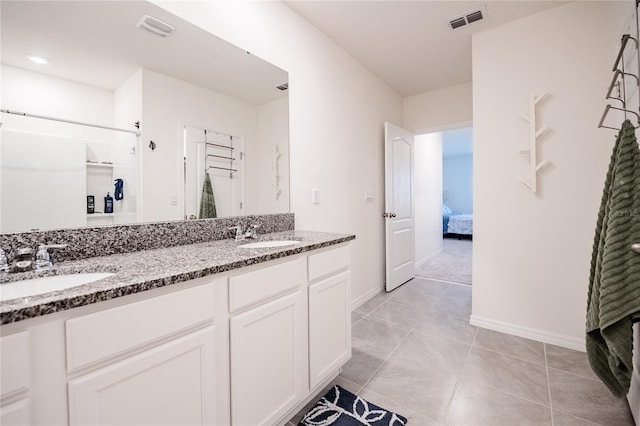 full bathroom with a sink, visible vents, and double vanity