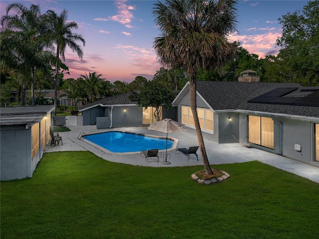 view of pool with a lawn, a fenced backyard, and a patio area