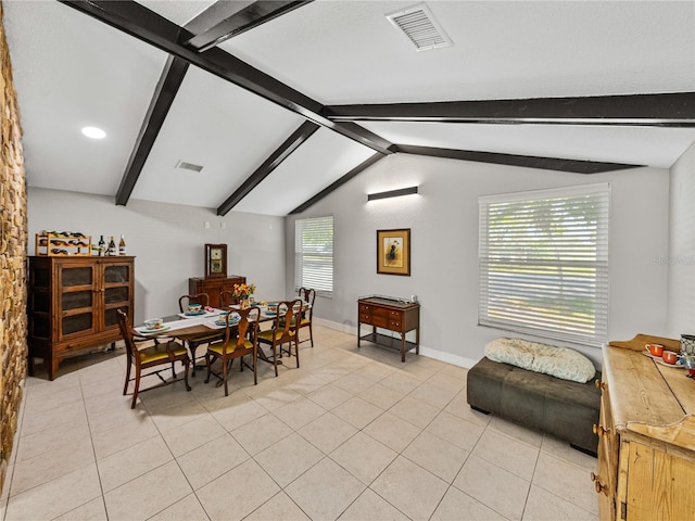 dining area featuring lofted ceiling with beams, light tile patterned floors, baseboards, and visible vents