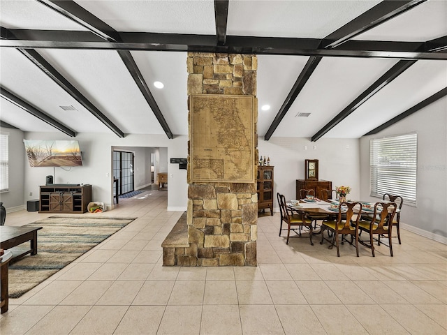 dining room featuring light tile patterned floors, visible vents, vaulted ceiling with beams, and baseboards