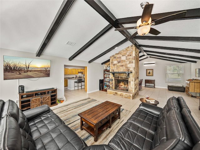 living room featuring vaulted ceiling with beams, visible vents, light tile patterned floors, and ceiling fan