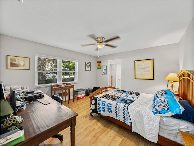 bedroom featuring light wood-style flooring and ceiling fan