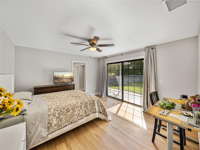 bedroom featuring ceiling fan, light wood-style flooring, visible vents, and access to exterior