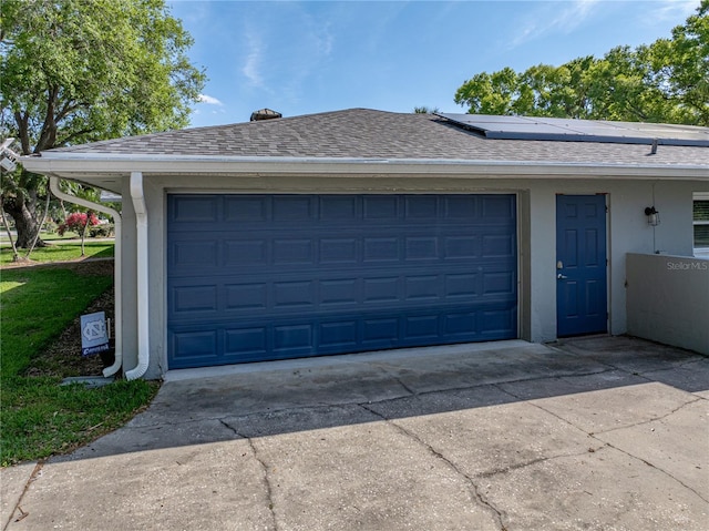 garage with roof mounted solar panels