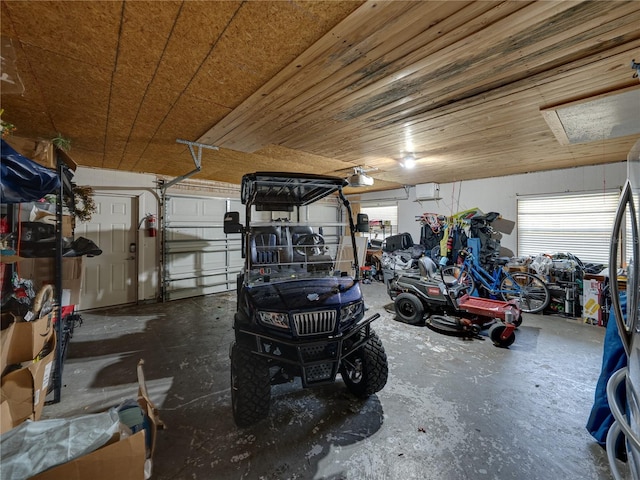 garage with wood ceiling and a garage door opener