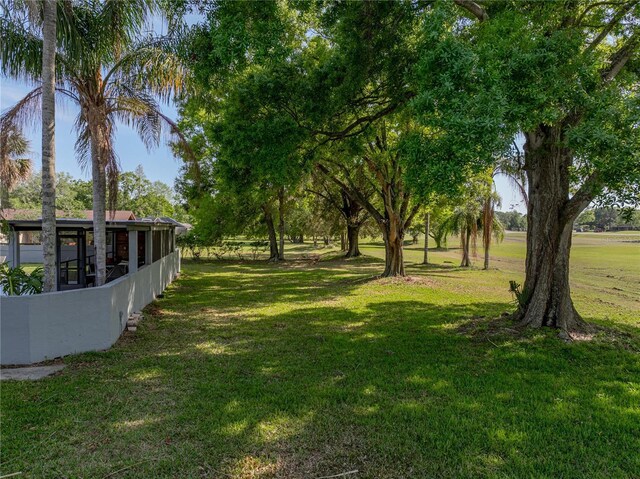view of yard with a sunroom