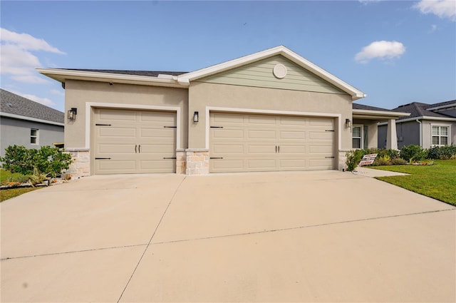 ranch-style home with stone siding, a garage, driveway, and stucco siding