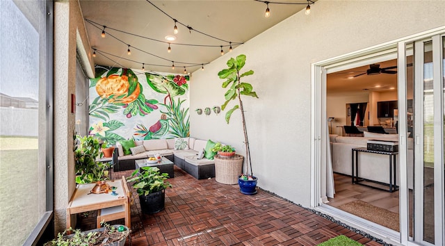 exterior space with ceiling fan and rail lighting