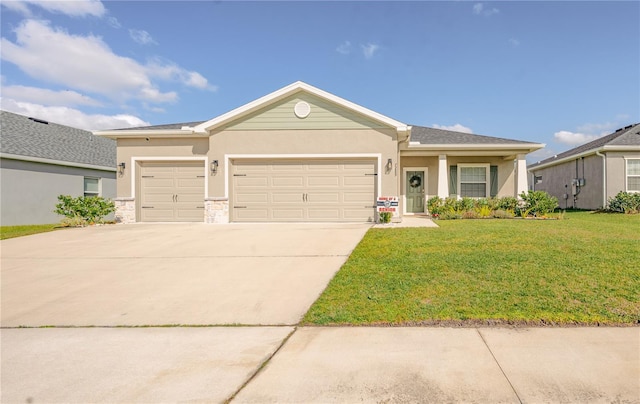 single story home featuring a front yard, a garage, driveway, and stucco siding