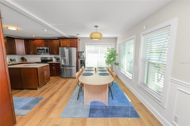 dining room with recessed lighting, light wood-style flooring, and visible vents