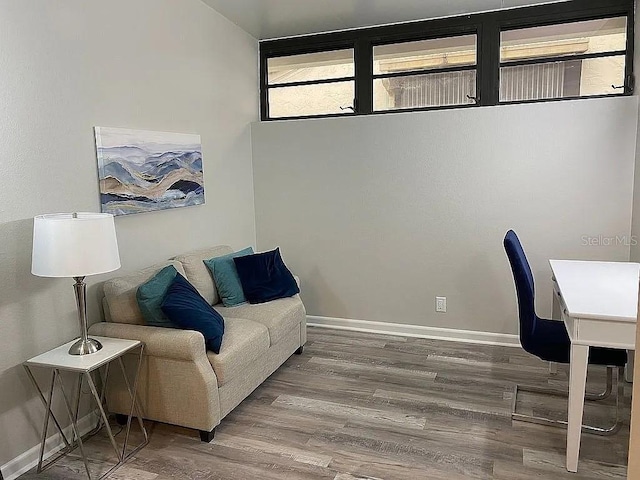 home office with wood finished floors and baseboards