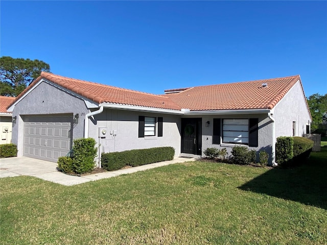 ranch-style house featuring a front yard, driveway, an attached garage, stucco siding, and a tiled roof