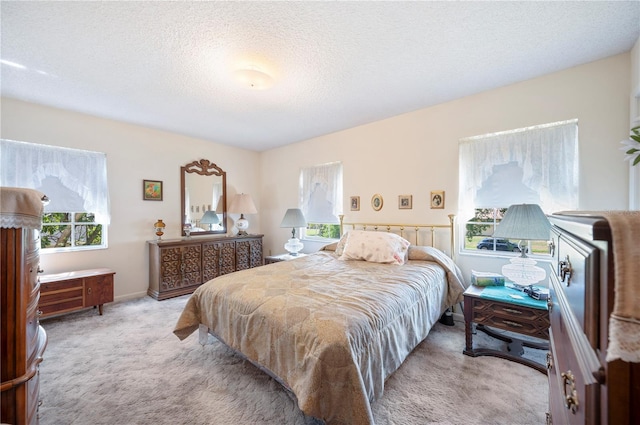 carpeted bedroom with a textured ceiling