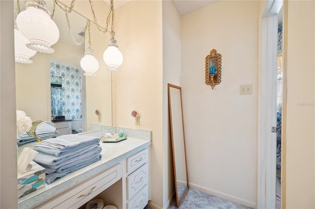 bathroom featuring vanity and baseboards