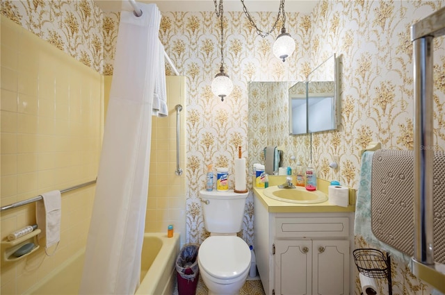 full bath with toilet, shower / bath combination with curtain, vanity, and wallpapered walls