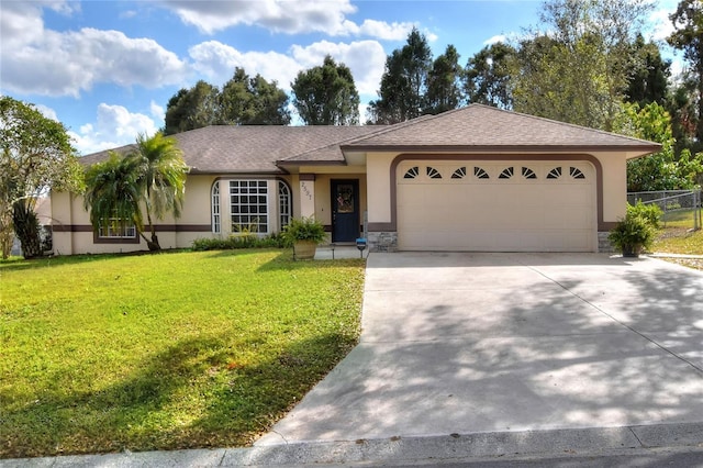 ranch-style home featuring roof with shingles, driveway, an attached garage, stucco siding, and a front lawn