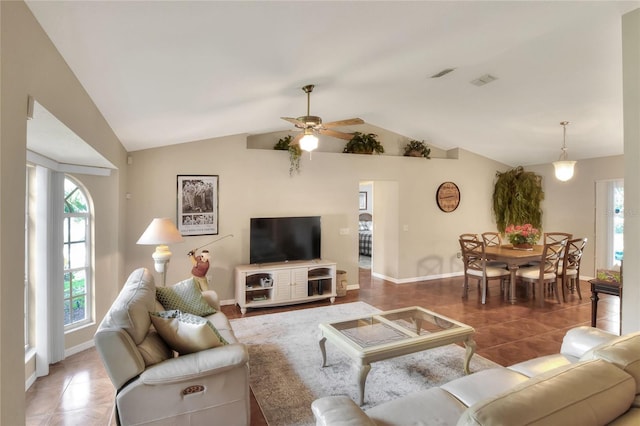 living room with tile patterned floors, visible vents, a ceiling fan, and lofted ceiling