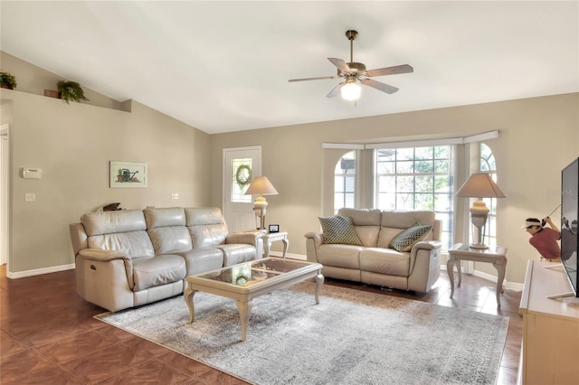 tiled living room with lofted ceiling, baseboards, and ceiling fan