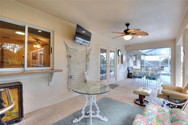 sunroom with french doors and ceiling fan