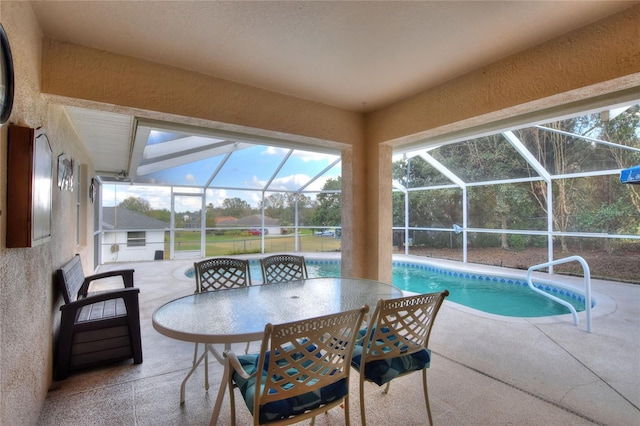 exterior space with a textured wall and a sunroom