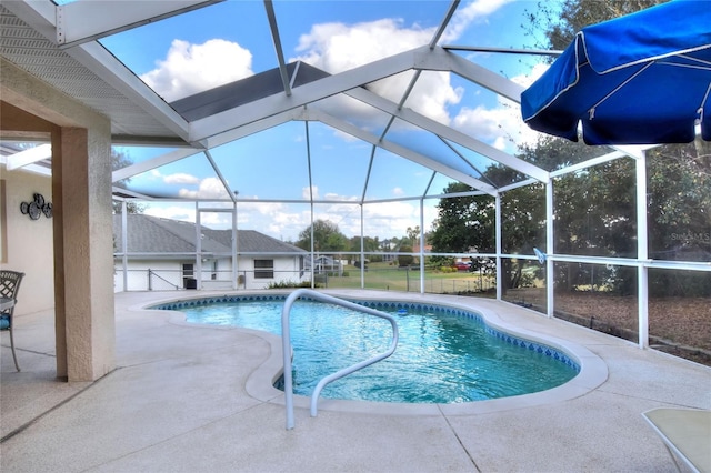 outdoor pool featuring a patio and a lanai