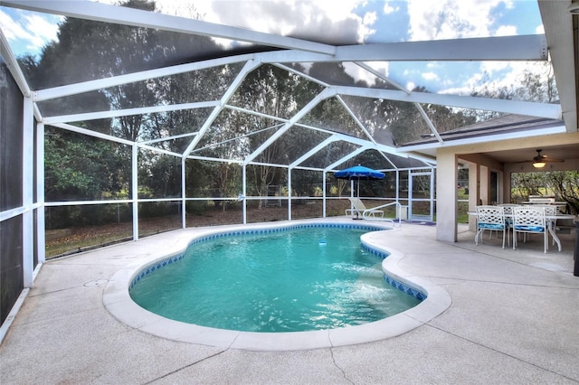 pool featuring outdoor dining space, a patio, and a lanai