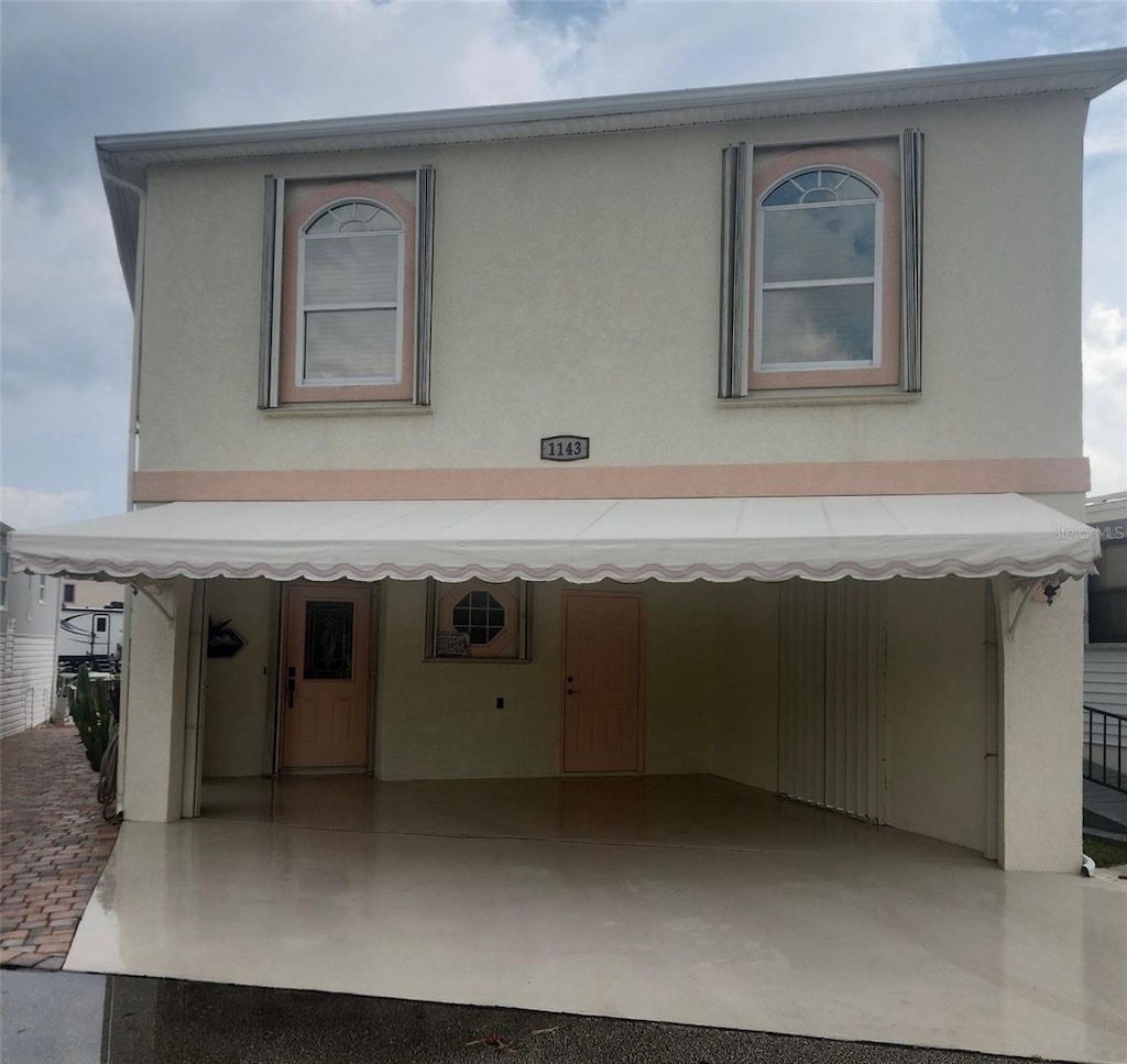 view of front of house featuring stucco siding