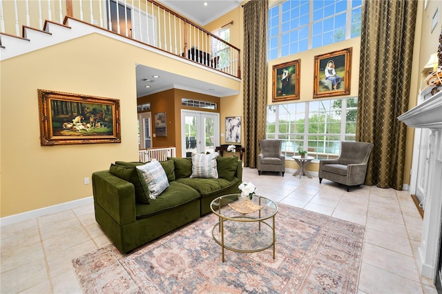 tiled living room with french doors, crown molding, and baseboards