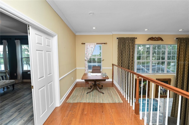 interior space with recessed lighting, baseboards, wood finished floors, and ornamental molding