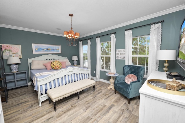 bedroom with baseboards, wood finished floors, a chandelier, and ornamental molding