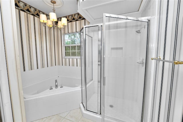 bathroom featuring a notable chandelier, a garden tub, a stall shower, wallpapered walls, and tile patterned flooring