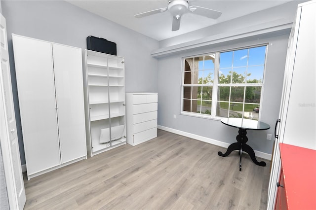 office with a ceiling fan, light wood-style floors, and baseboards