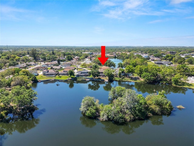 birds eye view of property featuring a water view and a residential view