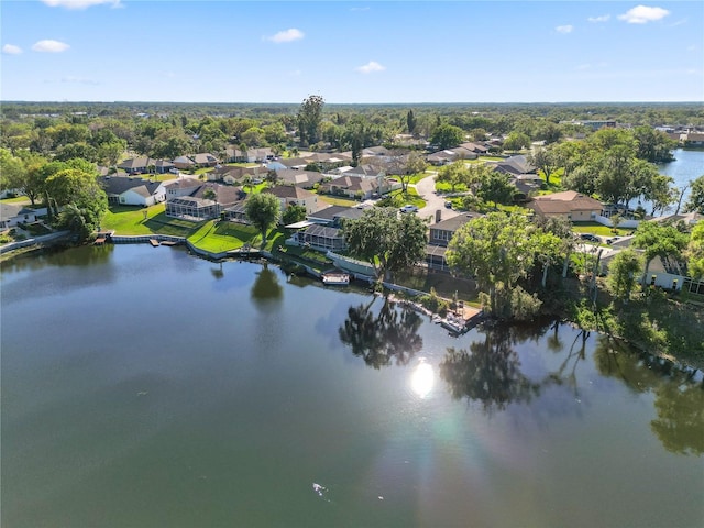 drone / aerial view featuring a residential view and a water view