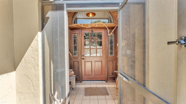 property entrance with stucco siding