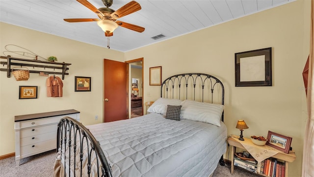 bedroom with baseboards, visible vents, carpet floors, and ceiling fan